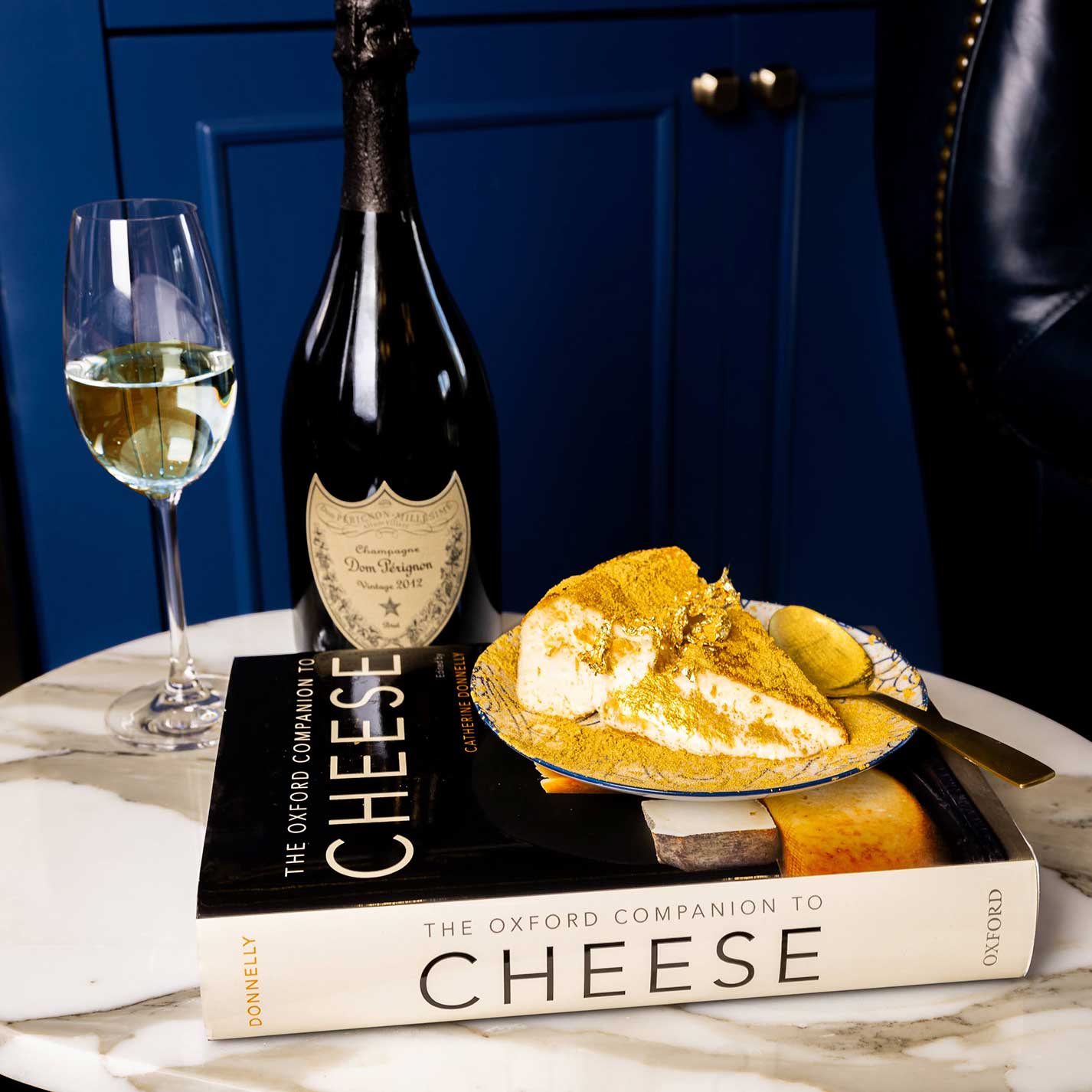 A slice of Chèvre Classic Burnt Basque Cheesecake with a glass of Dom Pérignon